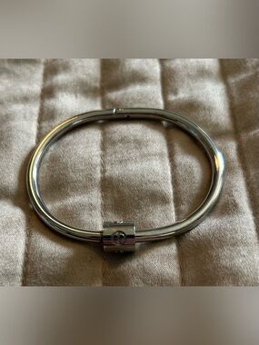 Silver Oval Hinged Bracelet with Signature Logo